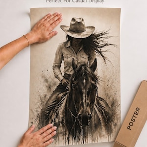 May include: A sepia-toned poster featuring an illustration of a person wearing a cowboy hat and long-sleeved shirt riding a horse. The artwork has a weathered, ink-wash aesthetic with splatters. The text Ink Jet Based Printing is visible.
