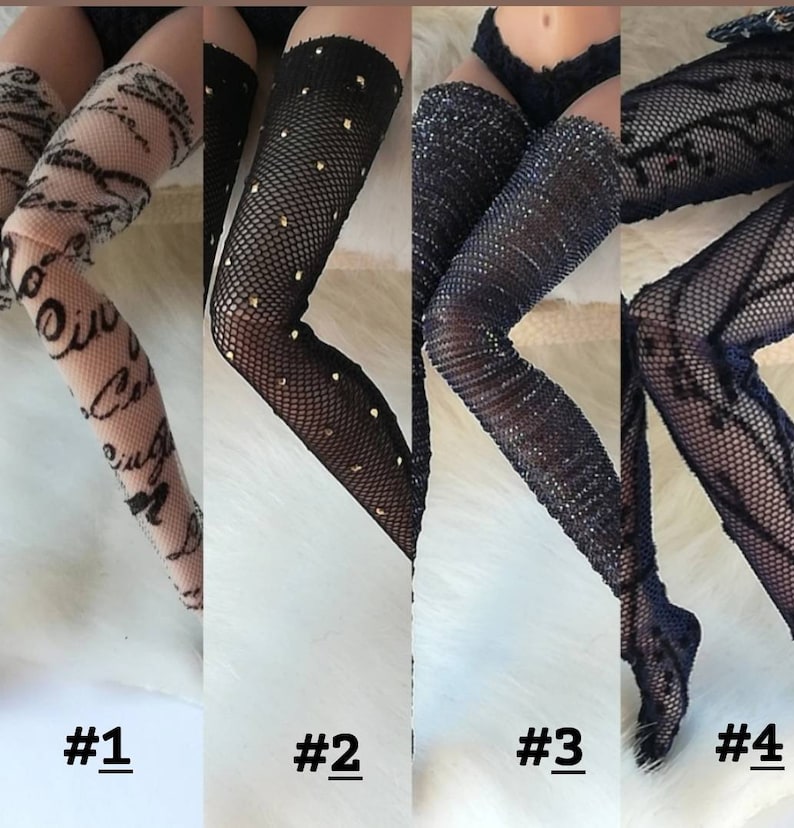 May include: Four pairs of black fishnet stockings with different patterns. The first pair has a white script pattern, the second pair has gold dots, the third pair has a sparkly finish, and the fourth pair has a floral pattern.