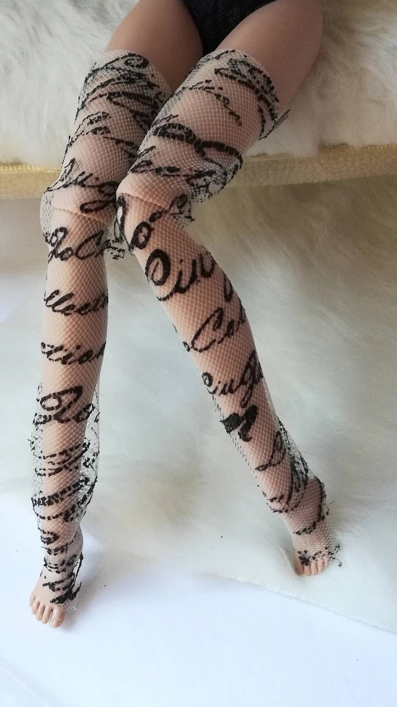 May include: White fishnet stockings with a black script pattern.