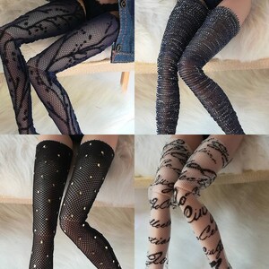 May include: Four pairs of black and white patterned tights. The tights are made of a sheer material and have a variety of different patterns, including polka dots, stripes, and floral designs.