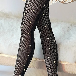 May include: Black fishnet stockings with gold heart-shaped embellishments.