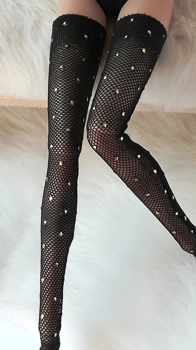 May include: Black fishnet stockings with gold glitter dots.