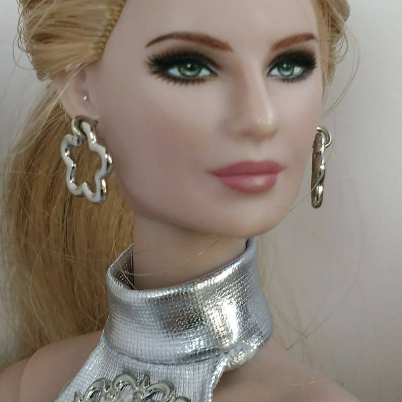 Fashion Doll earrings one size fits all same size doll!