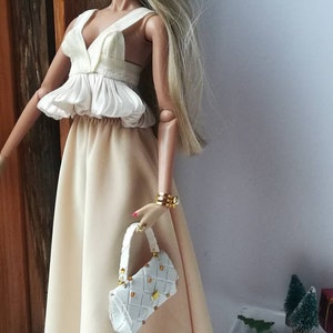 12 inch doll  fashion one size fit all same size doll.