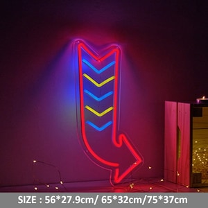 May include: A neon sign shaped like a curved arrow with a chevron pattern inside. The arrow is red, the chevron pattern is blue and yellow, and the sign is lit up against a dark purple background. SIZE: 56*27.9cm/65*32cm/75*37cm
