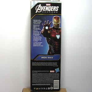 May include: A Marvel Avengers Endgame Iron Man action figure box. The box features a red and gold Iron Man illustration with the text "Iron Man" and "Avengers Endgame". The box also includes text in multiple languages.