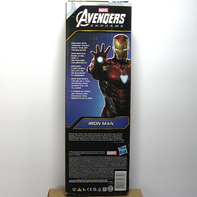 May include: A Marvel Avengers Endgame Iron Man action figure box. The box features a red and gold Iron Man illustration with the text "Iron Man" and "Avengers Endgame". The box also includes text in multiple languages.