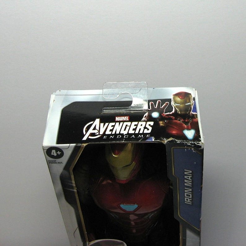 May include: A Marvel Avengers Endgame Iron Man action figure in its original packaging. The box features the Avengers logo and an image of Iron Man. The figure is recommended for ages 4 and up.