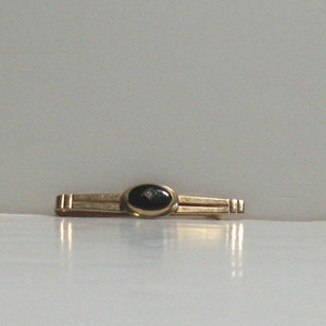 Vintage 1950s/1960s, Gold Tone Tie Bar with Black Oval Stone and Rhinestone