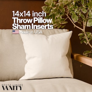 May include: A white 14x14 inch throw pillow insert on a beige couch. The pillow is made in the USA. The text "HOUSE LINENS VANITY" is visible in the bottom left corner of the image.