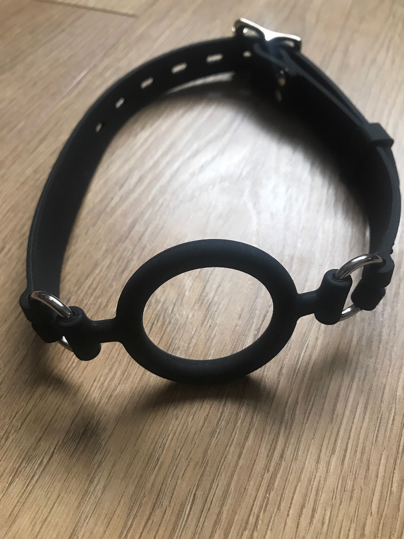 Ring gag in the UK bdsm gear for submissive women and men. Silicone lockable kink gag. Medical fetish gag. 