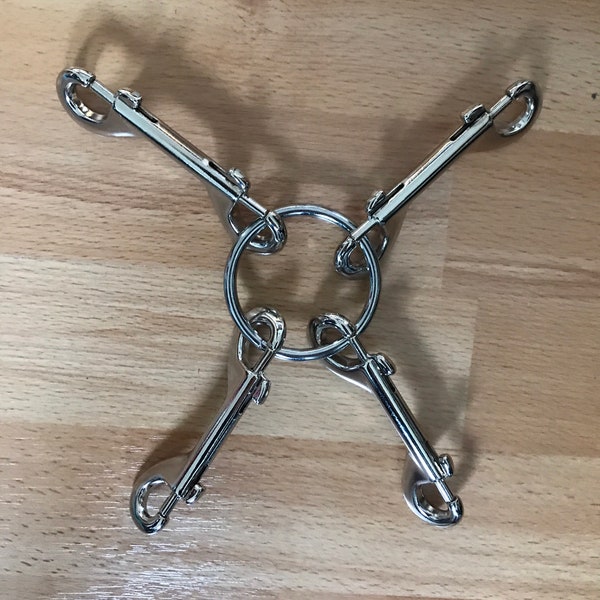 Bondage clips, trigger clips and solid welded rings for fastening restraints, collars, cuffs, BDSM gear for submissive women.