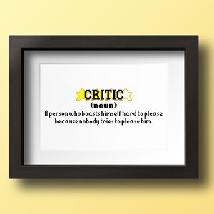 May include: A framed print with a yellow star design and the word "CRITIC" in black text. The text below reads "(noun) A person who boasts himself hard to please because nobody tries to please him."