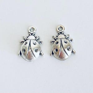 Small Antique Silver Finished Ladybug Pendant. Small Ladybug Charm. Wholesale Craft Supplies. DIY Craft Supplies. Charm Wholesaler.
