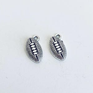 Small Antique Silver Finished Football Pendants. Silver Tone Football Charms. Key Chain Accessories. Handmade Jewelry Supplies. DIY Crafts