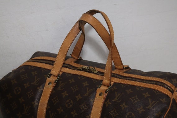 Sac souple leather travel bag Louis Vuitton Brown in Leather