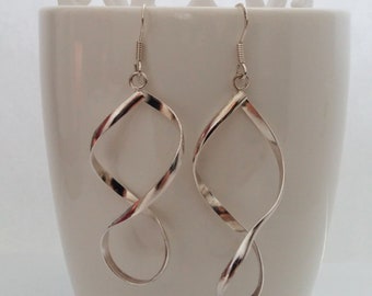 Pendientes colgantes de plata de ley con el símbolo del infinito: joyería moderna
