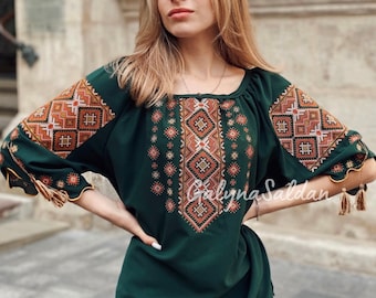 Dark green ukrainian vyshyvanka. National embroidered shirt with half sleeve