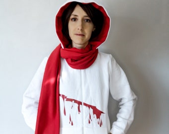 May include: A white hooded sweatshirt with a red scarf and a red blood splatter design on the front.