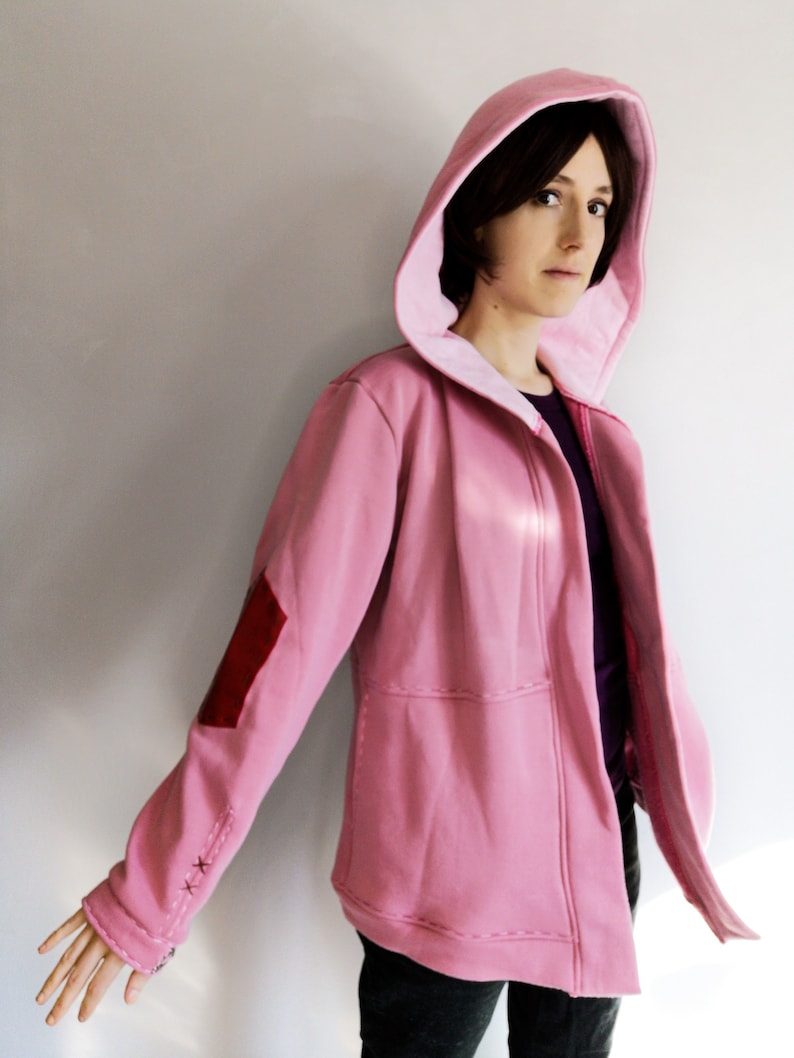 May include: A set of three ceramic mugs with a speckled, matte finish. The mugs are in shades of cream, light gray, and dark gray. Each mug has a simple, minimalist design, perfect for coffee or tea.