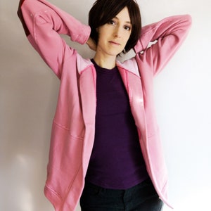 May include: A set of three ceramic mugs with a speckled, matte finish. The mugs are in shades of cream, light gray, and dark gray. Each mug has a simple, minimalist design and a rounded handle.