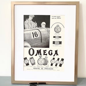 May include: A vintage black and white advertisement for Omega watches featuring a race car driver and the text "Le monde élégant porte une OMEGA" and "MONTRE DE PRECISION".