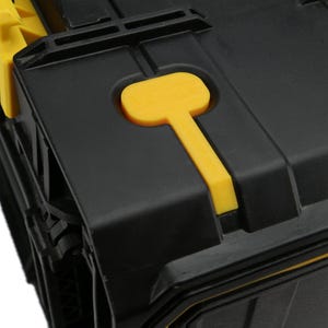 May include: Close-up of a black toolbox with a yellow latch. The latch has a yellow handle.