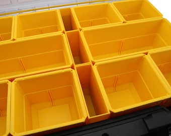 May include: A yellow plastic storage box with multiple compartments. The compartments are empty and ready to be filled with tools or other items.