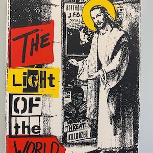 May include: A print with the words "THE LIGHT OF THE WORLD" in red, yellow, and white. The image features a depiction of Jesus with a yellow halo, and other text and images in black and white.