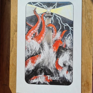 May include: A tarot card illustration depicting a lighthouse being engulfed by a giant octopus tentacle with lightning strikes in the background. The card is titled "The Tower".