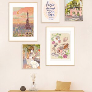 May include: A set of four framed illustrations with a Parisian theme. The illustrations include the Eiffel Tower, a Parisian cafe, a woman reading a book, and a breakfast scene with coffee, croissants, and flowers.