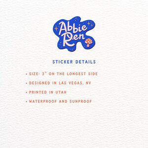 May include: A blue, irregular-shaped sticker logo featuring the text Abbie Ren with a small mushroom and stars. Text below reads STICKER DETAILS, SIZE: 3" ON THE LONGEST SIDE, DESIGNED IN LAS VEGAS, NV, PRINTED IN UTAH, WATERPROOF AND SUNPROOF.