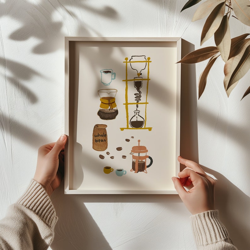 May include: A framed illustration of different coffee brewing methods, including a pour-over coffee maker, a French press, and a coffee grinder. The illustration is in a minimalist style with a light background and simple lines. The text "whole bean" is included in the illustration.