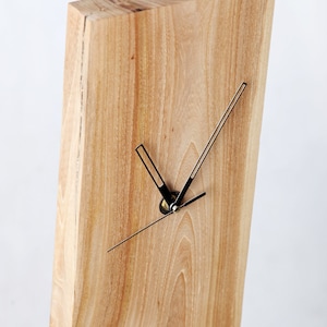 Wall clock made of natural wood