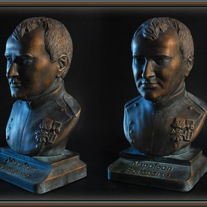 May include: Four bronze busts of Napoleon Bonaparte on individual bases. Each bust is a different angle of the same sculpture. The bases are inscribed with "Napoleon Bonaparte".