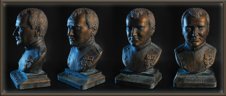 May include: Four bronze busts of Napoleon Bonaparte on individual bases. Each bust is a different angle of the same sculpture. The bases are inscribed with "Napoleon Bonaparte".