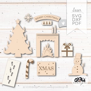 以下が含まれることがあります： レーザーカットされたクリスマスをテーマにした木製装飾のセット。クリスマスツリー、暖炉、雪だるま、キャンディーケーン、