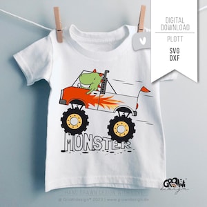 May include: A white t-shirt featuring a green dinosaur driving a red monster truck with flames. The text "MONSTER" is printed below the truck. The design is hand-drawn and includes the text "HAND DRAWN DESIGN WITH LOVE @GroWidesign* 2023 | www.growidesign.de".
