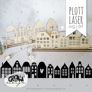 May include: A digital design file for a laser cut or plotter cut Christmas village silhouette. The design features a row of ten houses with various window and door details. The design is in black and white and is perfect for creating a festive holiday decoration.