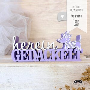 Puede incluir: Un juego de tres tazas de cerámica con un acabado mate moteado. Las tazas son de color crema, gris claro y gris oscuro. Cada taza tiene un diseño simple y minimalista y un asa redondeada.