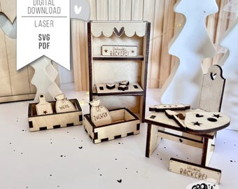May include: A wooden miniature bakery playset with a shelf, two boxes labeled "Mehl" and "Zucker", a chair, and a sign that reads "Willkommen Backerei".