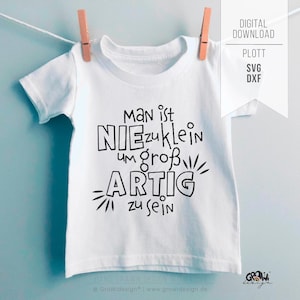 May include: A white t-shirt with black text that reads "Man ist NIEzuklein um groß ARTIG zu sein." The shirt is hanging from a clothesline with two wooden pegs. A digital download graphic is in the upper right.