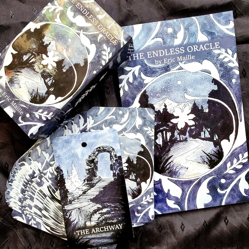 May include: The Endless Oracle deck and guidebook by Eric Maille. The box, book, and cards feature a blue and white floral design. The cards show a snowy landscape with an archway and the text "THE ARCHWAY".