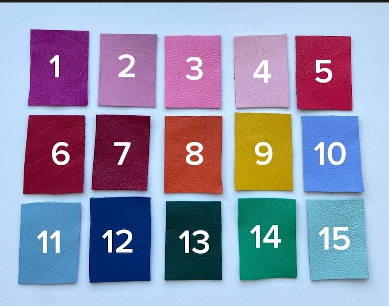 May include: A numbered chart of 15 different colored leather swatches. The swatches are arranged in three rows of five. The swatches are numbered 1 through 15.