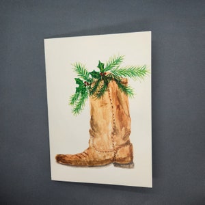 Cartão de Natal pintado à mão com bota de cowboy