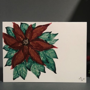 Cartão de Natal pintado à mão com poinsétia vermelha