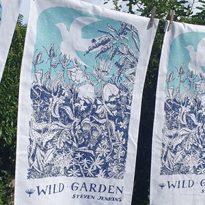 Wild Garden Teatowel in linen union turquoise/navy of teasles, evening primrose, campion and white dove - ink drawing