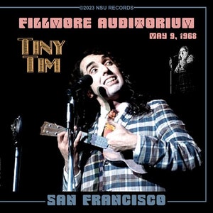 May include: A black and white photograph of Tiny Tim performing live at the Fillmore Auditorium in San Francisco on 9 May 1968. He is playing a ukulele and singing into a microphone. The text "Fillmore Auditorium" and "Tiny Tim" are in a pink and gold font.