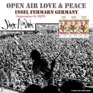 May include: Black and white photo of Jimi Hendrix performing on stage at an outdoor concert. The stage is surrounded by a large crowd of people. The text "OPEN AIR LOVE & PEACE" and "INSEL FEHMARN GERMANY" is at the top of the image. The date "September 6, 1970" is below the text. The text "Jimi Hendrix" is written in cursive at the bottom left of the image.