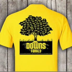 May include: A bright yellow t-shirt features a black graphic of a tree filled with names, above the words "DOWNS FAMILY". Below the tree is the text "50 YEAR BIRTHDAY CELEBRATION". The shirt is made of a soft material.